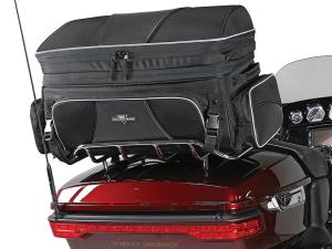Photo of Traveler on red Harley Davidson trunk