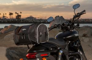 Photo of Daytrip on Black Harley Davidson with water in the background