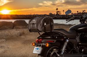 Photo of Daytrip on Black Harley Davidson with water in the background