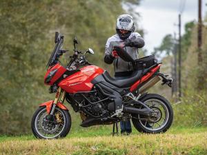 Photo of tail bag on bike - guy opening bag 