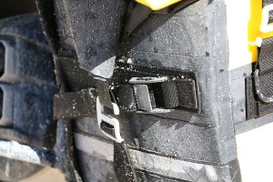 Close up of closure and mounting straps covered in mud