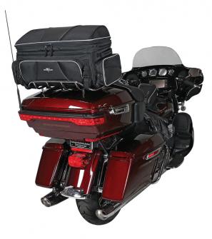 Photo of Traveler on red Harley Davidson trunk